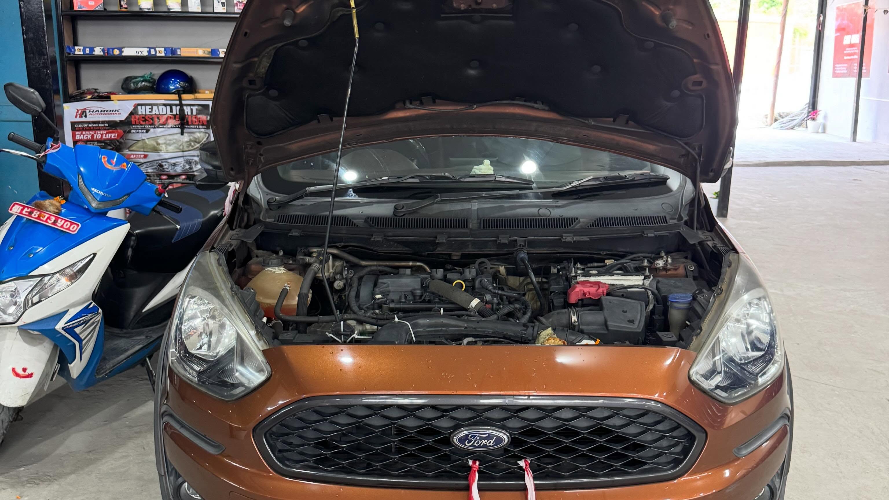 Professional detailing technician cleaning a car interior